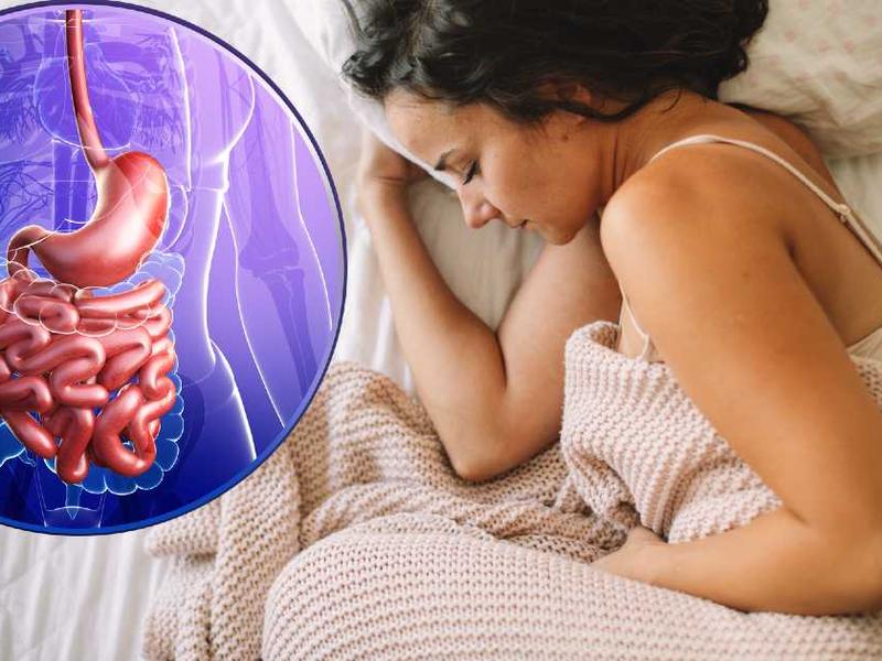 Mujer en cama con dolor de estómago / ilustración aparato digestivo