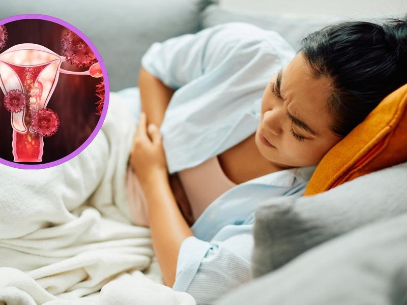 Mujer acostada en la cama por un fuerte dolor a a causa de endometriosis 