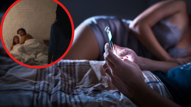 Hombre mensajea desde su celular mientras su pareja duerme