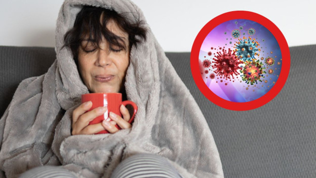 Mujer sosteniendo taza roja se pregunta cuánto tiempo tarda en curarse una gripe, ilustración de virus