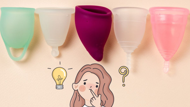 Diferentes tipos de copas menstruales sobre una superficie rosa